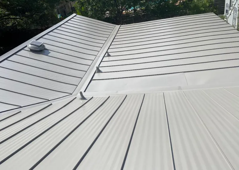 Solar attic fan installed on a metal roof for Roof Ventilation in Cocoa